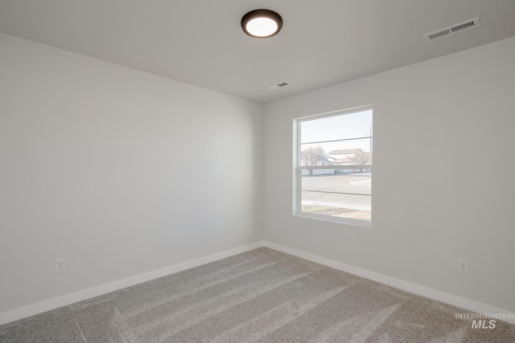 3310 South Maple Rnch Way Nampa, ID 83686 - Photo 6 of 19 Carpeted spare room with baseboards