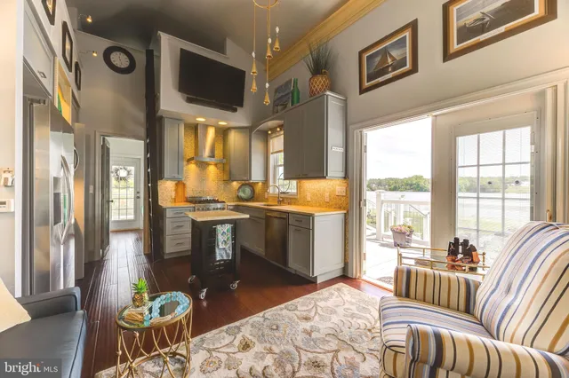 a bedroom with furniture and a large window