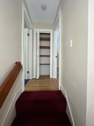 a bedroom with a bed and a closet