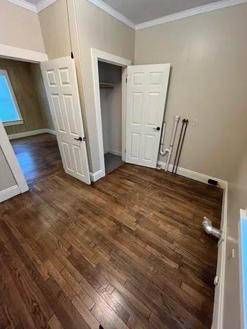 a view of an entryway with wooden floor