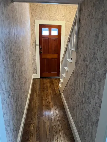 a view of balcony with wooden floor