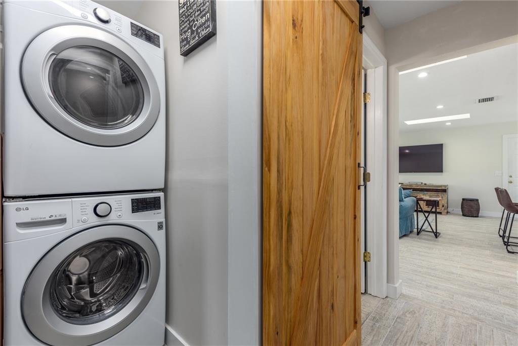 1453 Northwest Spruce Ridge Drive Stuart, FL 34994 - Photo 21 of 27 a view of a hallway with washer and dryer