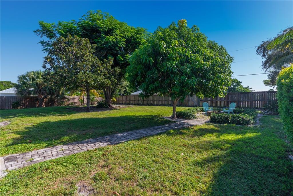1453 Northwest Spruce Ridge Drive Stuart, FL 34994 - Photo 23 of 27 a view of a park with large trees