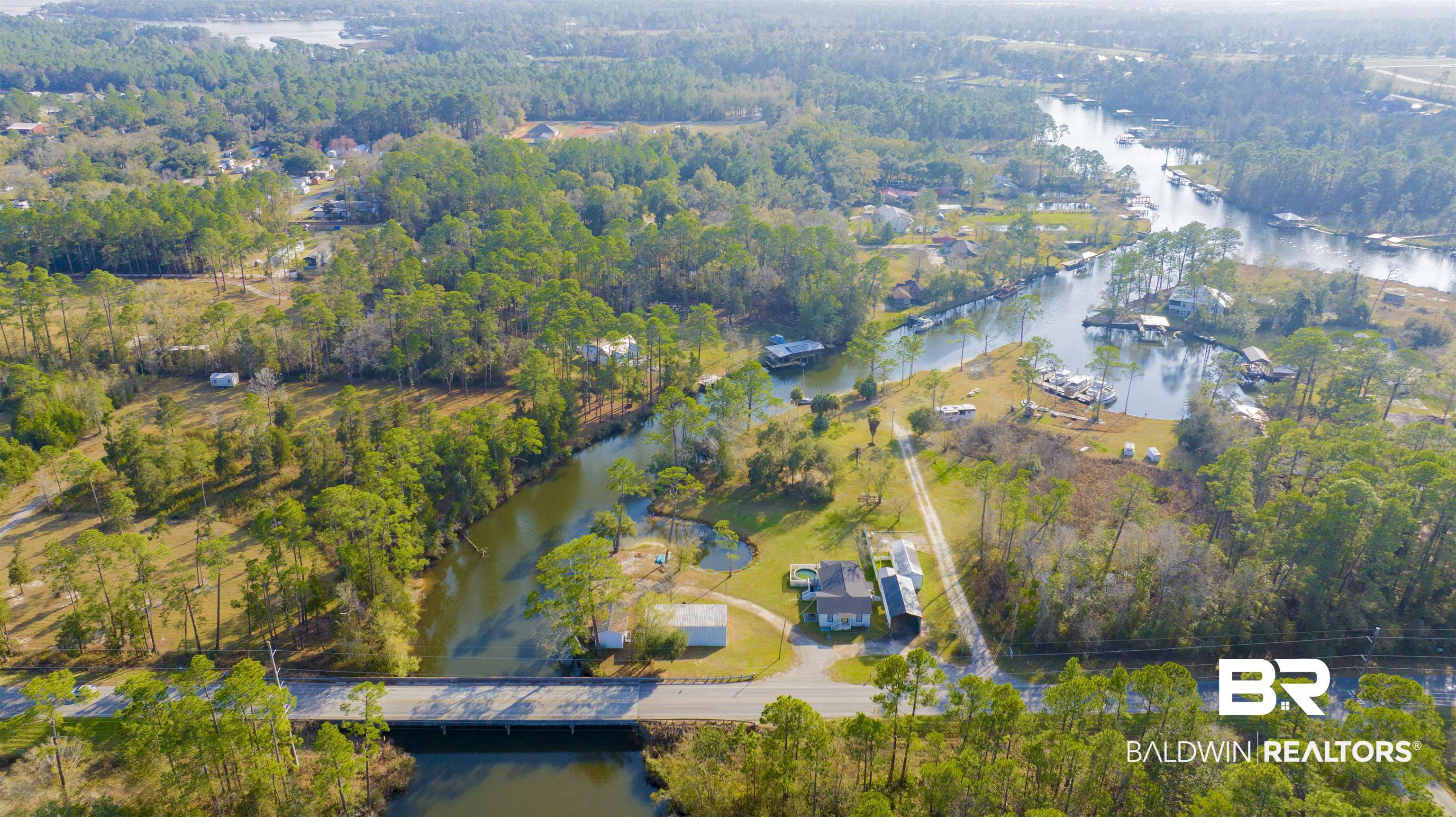 23770 Miflin Road Elberta, AL 36530 - Photo 34 of 38 Aerial view of property and surrounding area featuring a nearby body of water and a notable bridge