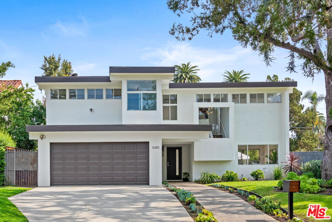 1680 Virginia Road Los Angeles, CA 90019 - Photo 1 of 51 a front view of house with yard