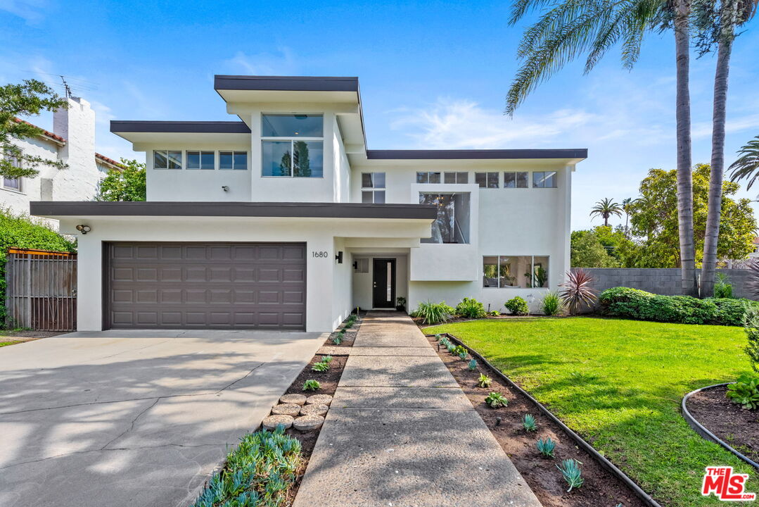 1680 Virginia Road Los Angeles, CA 90019 - Photo 3 of 51 a front view of a house with yard