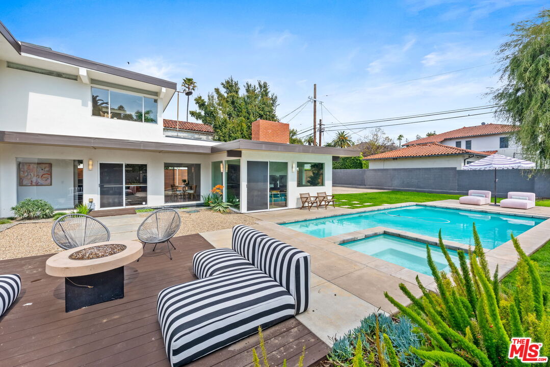 1680 Virginia Road Los Angeles, CA 90019 - Photo 42 of 51 a view of a patio with swimming pool table and chairs