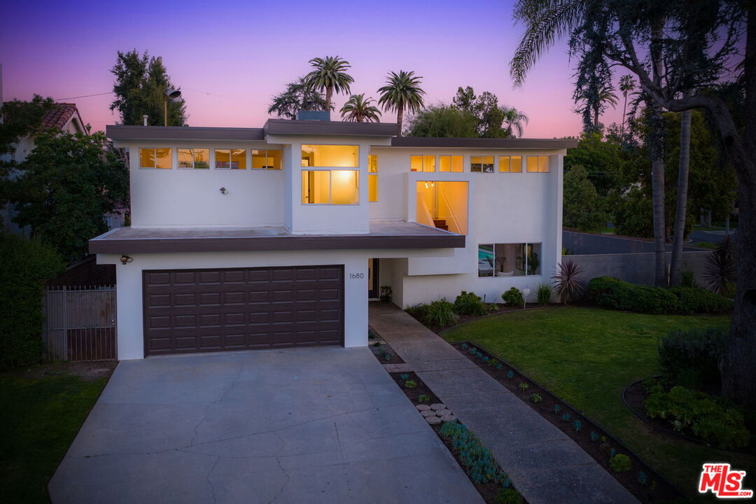 1680 Virginia Road Los Angeles, CA 90019 - Photo 46 of 51 a front view of a house with a garden and yard