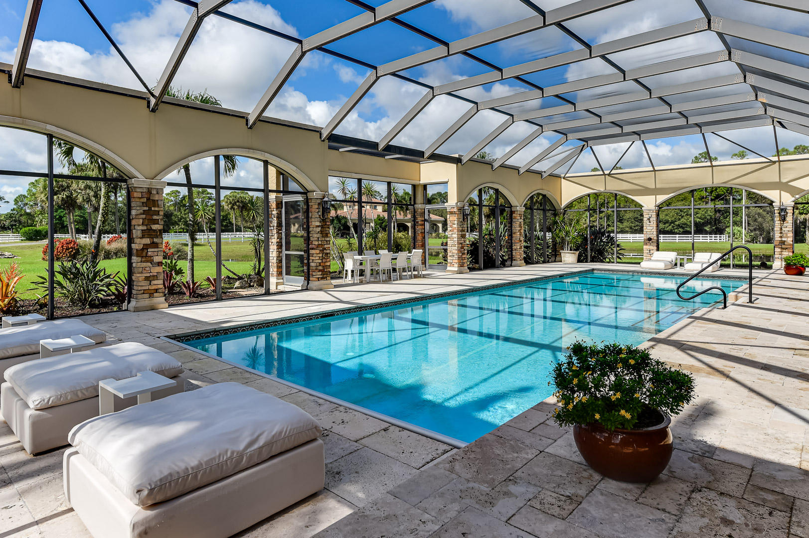 19700 Mack Dairy Road Jupiter, FL 33478 - Photo 36 of 48 a view of a swimming pool with a patio