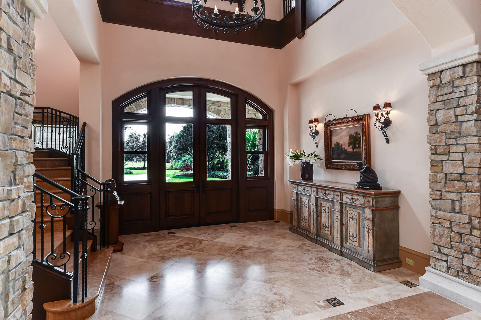 19700 Mack Dairy Road Jupiter, FL 33478 - Photo 10 of 48 a view of a hallway with entryway wooden floor and windows