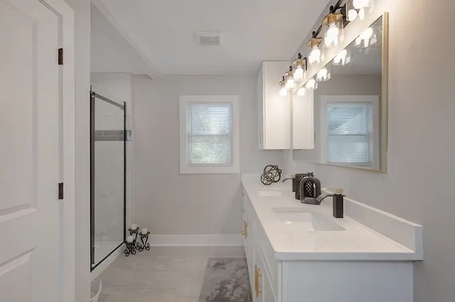 a bathroom with a sink and a mirror