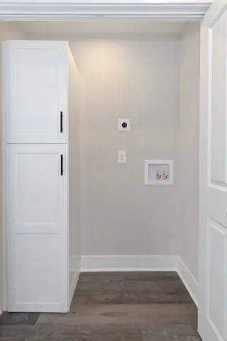 a view of backyard of house with green space