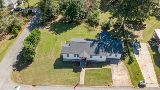 an aerial view of residential houses with outdoor space
