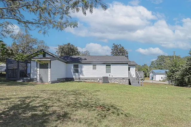 a kitchen with stainless steel appliances a refrigerator sink and cabinets