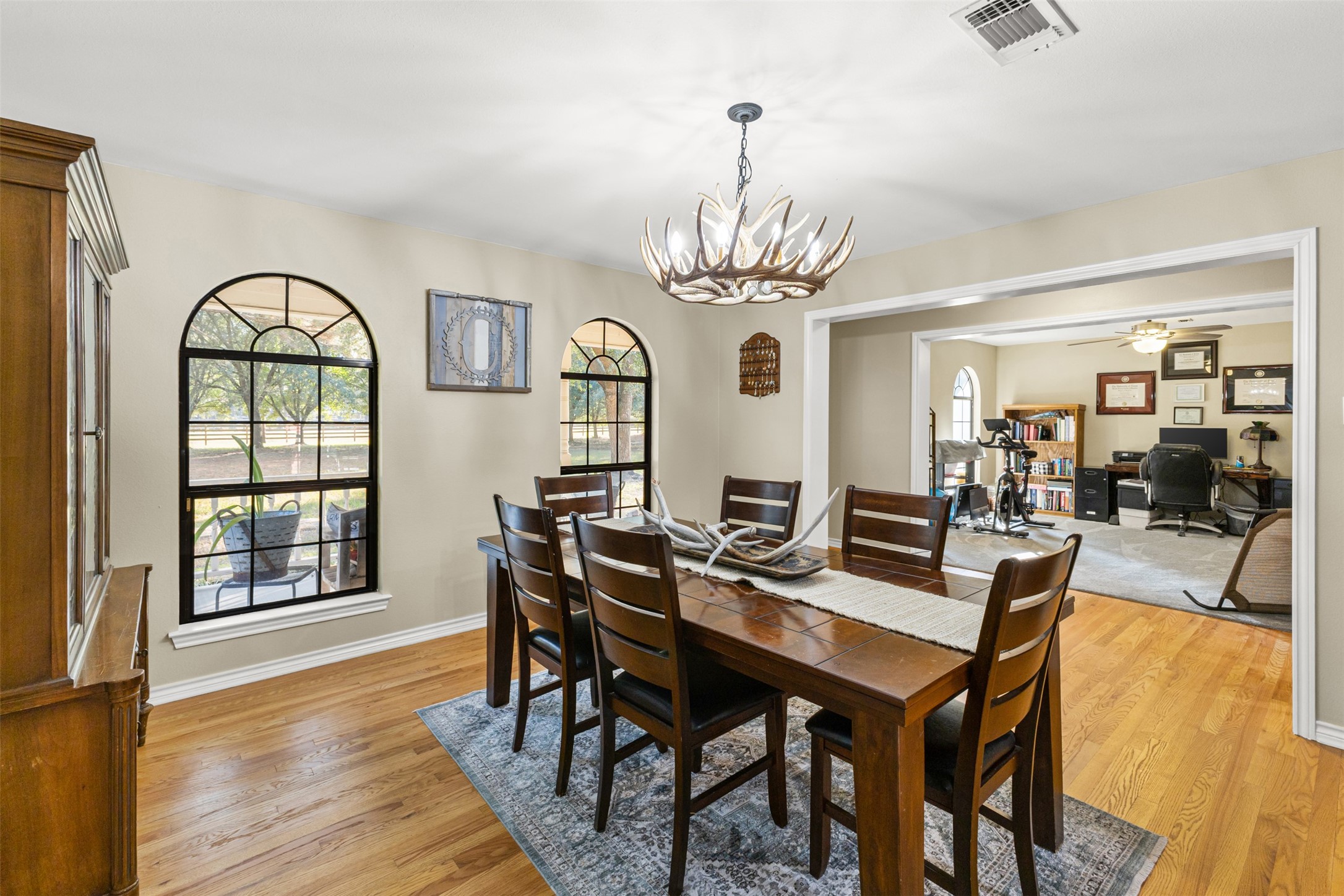 31928 Reids Prairie Road Waller, TX 77484 - Photo 11 of 49 a view of a dining room with furniture window and wooden floor