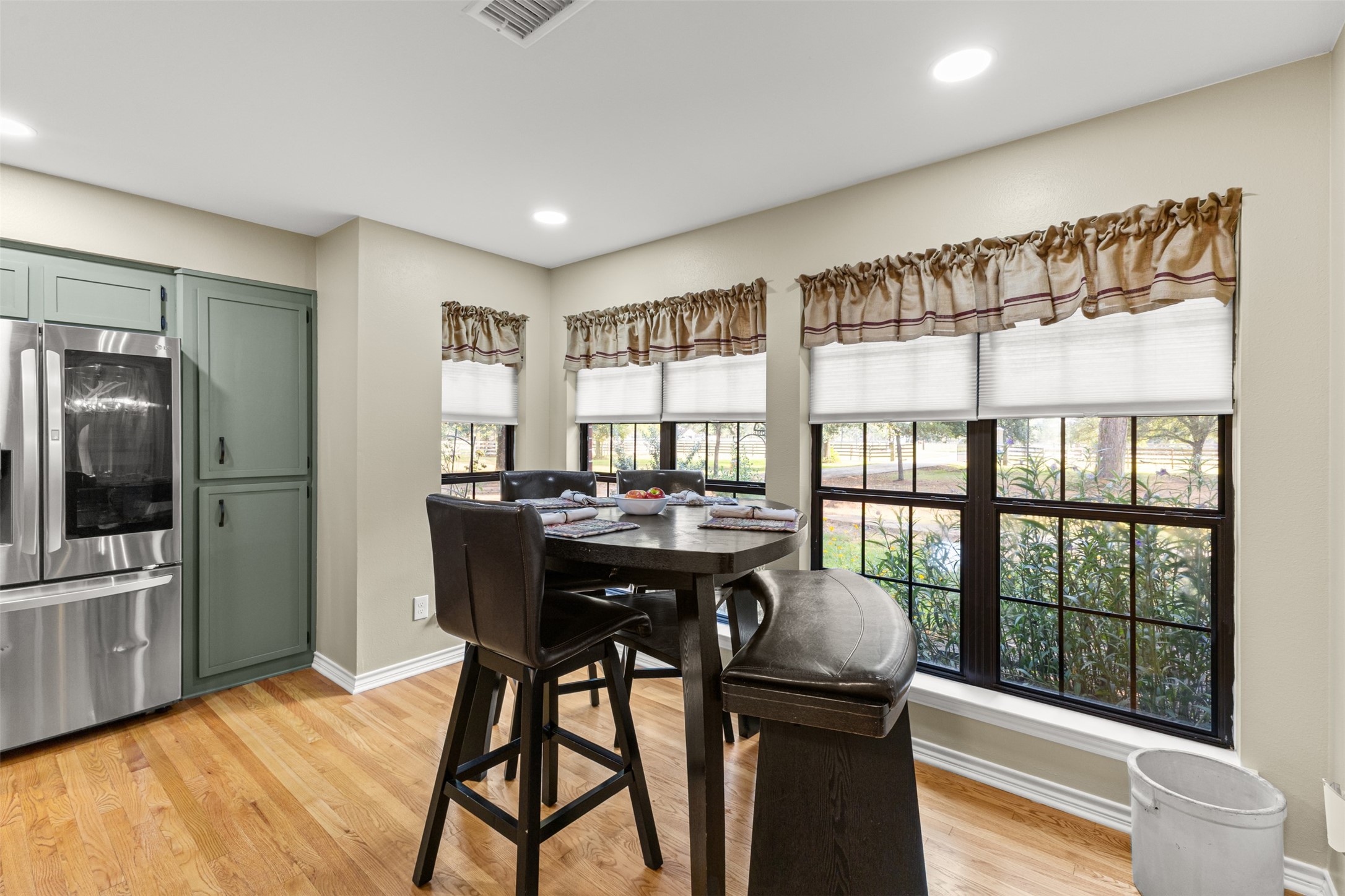 31928 Reids Prairie Road Waller, TX 77484 - Photo 15 of 49 a view of a dining room with furniture window and wooden floor