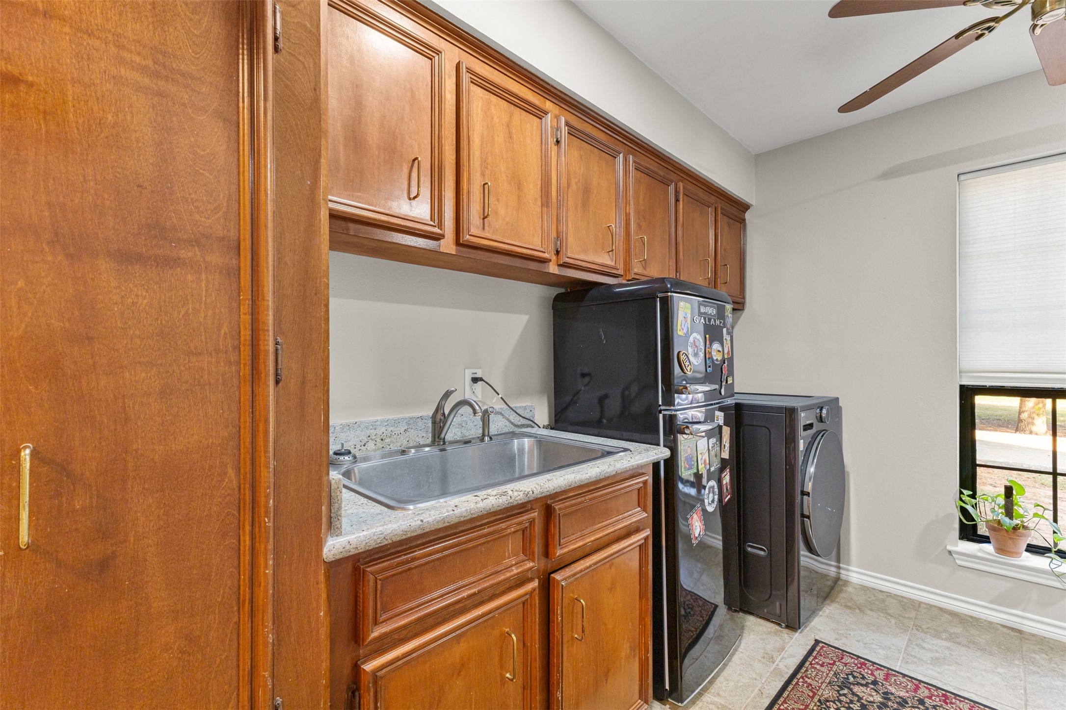 31928 Reids Prairie Road Waller, TX 77484 - Photo 19 of 49 a kitchen with stainless steel appliances granite countertop a sink and cabinets