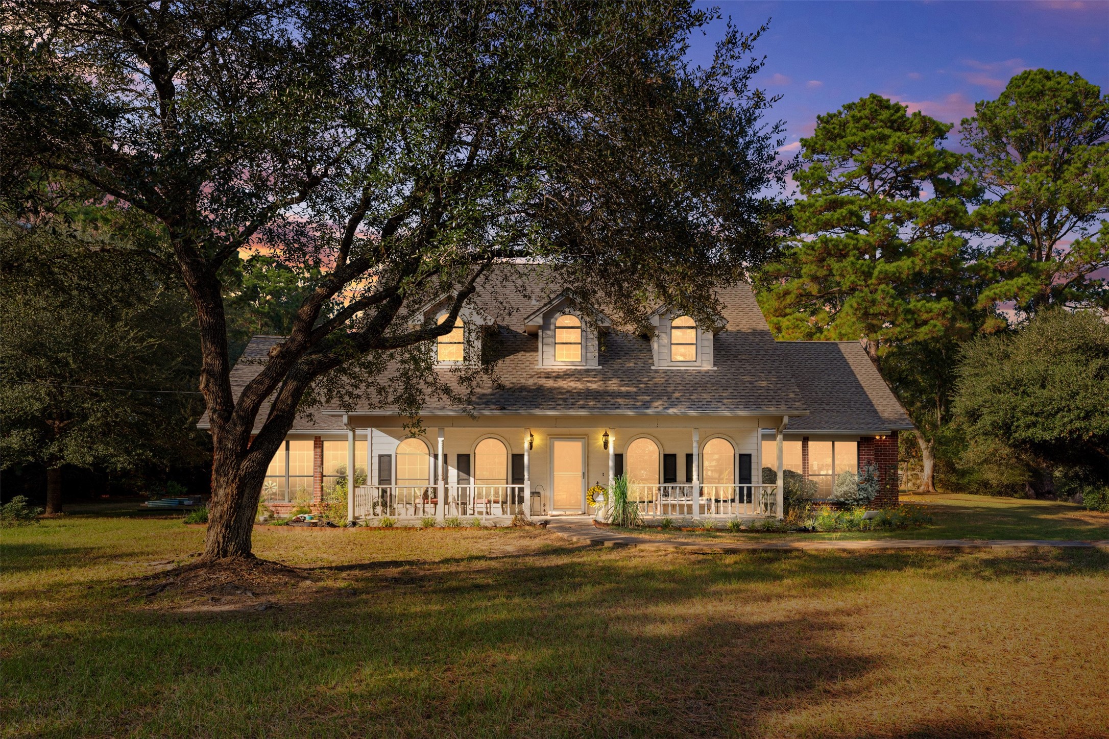 31928 Reids Prairie Road Waller, TX 77484 - Photo 2 of 49 a front view of a house with a garden