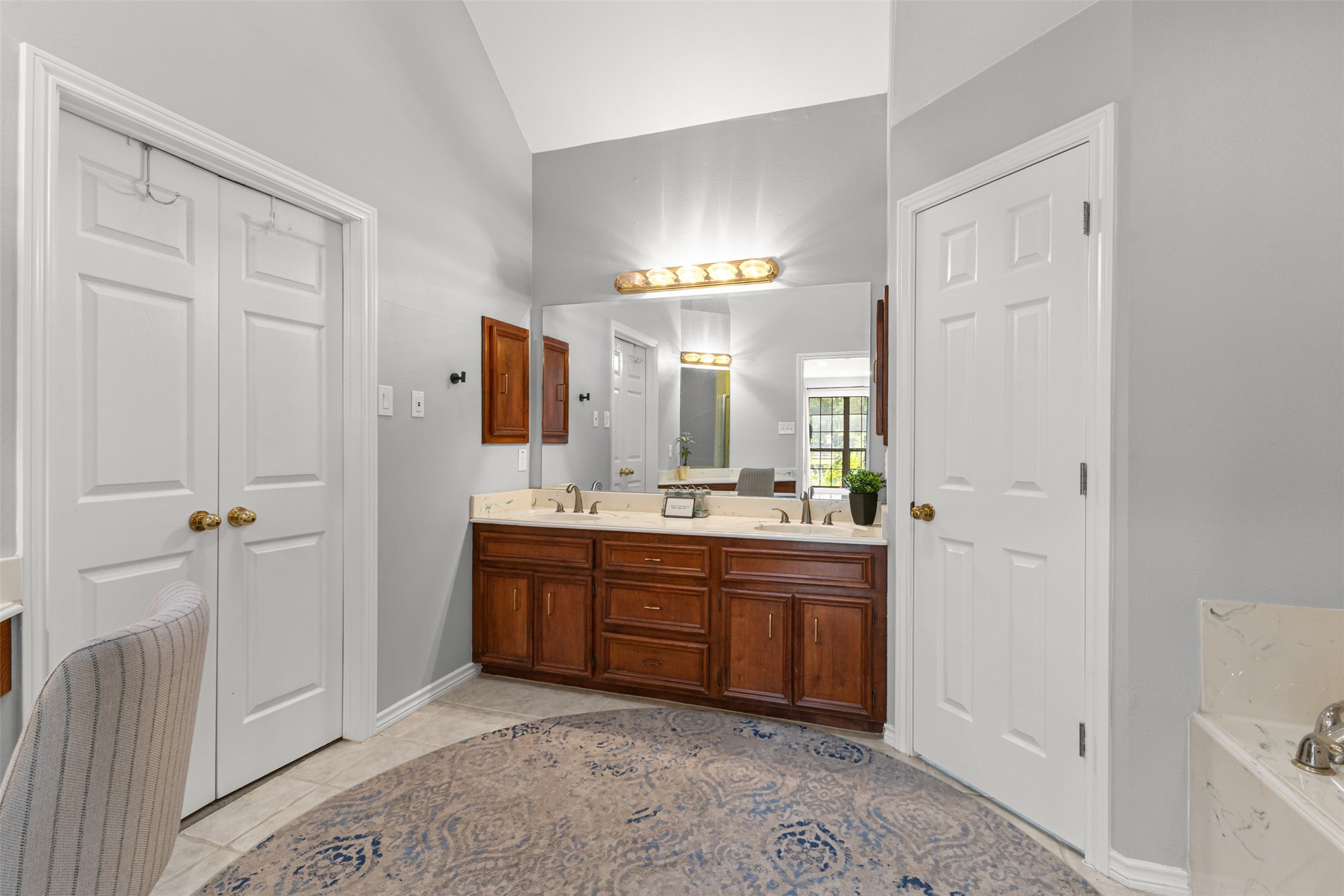 31928 Reids Prairie Road Waller, TX 77484 - Photo 25 of 49 a spacious bathroom with a double vanity sink and a mirror