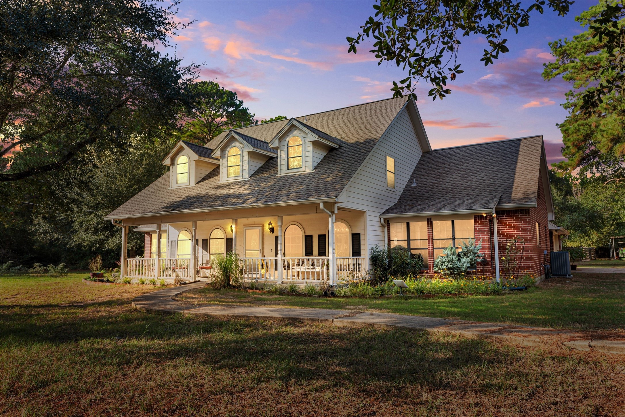 31928 Reids Prairie Road Waller, TX 77484 - Photo 3 of 49 a front view of a house with a garden