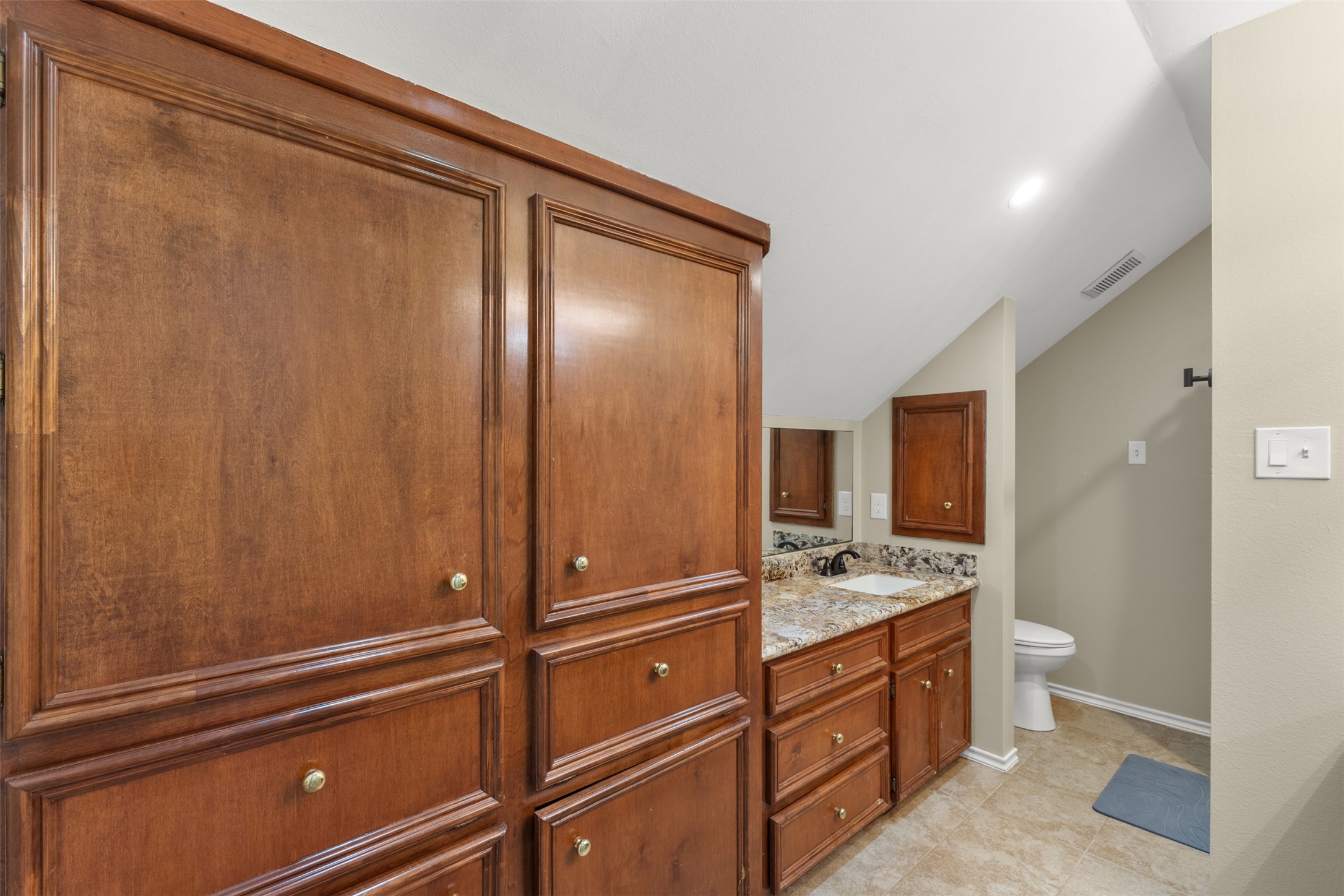 31928 Reids Prairie Road Waller, TX 77484 - Photo 35 of 49 a kitchen with a refrigerator and cabinets