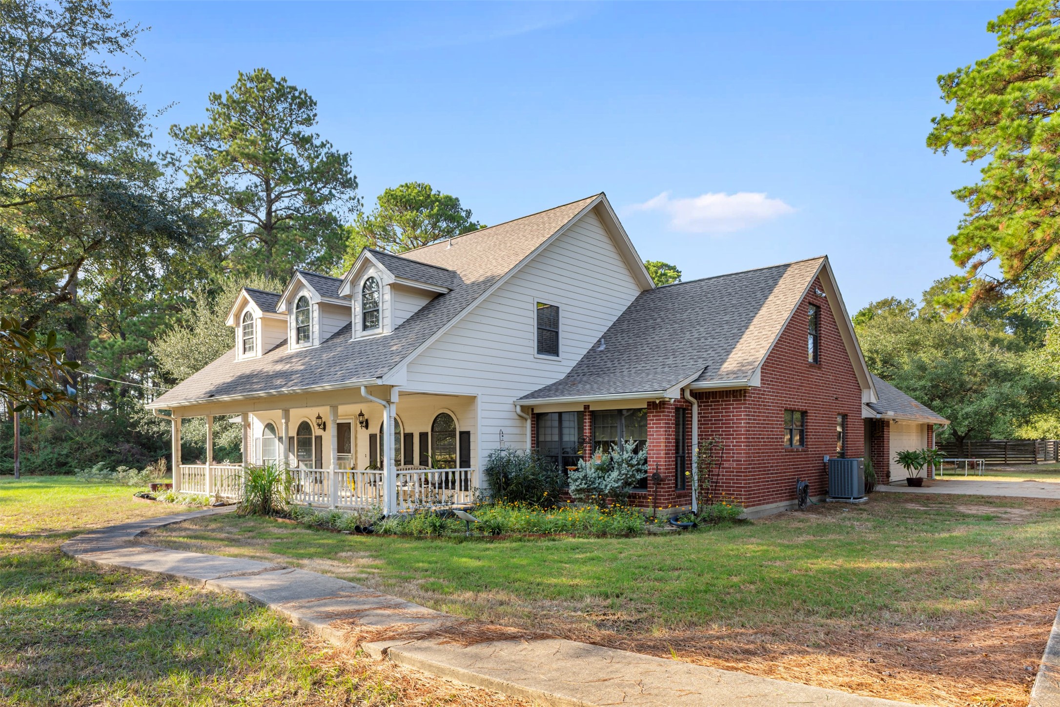31928 Reids Prairie Road Waller, TX 77484 - Photo 4 of 49 a front view of a house with a garden