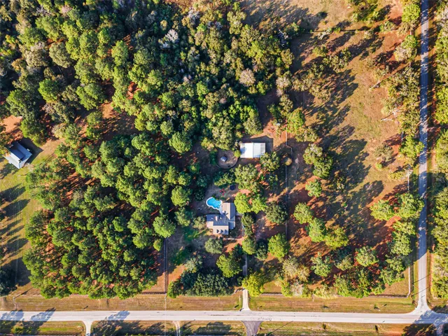 a backyard of a house with lots of tree
