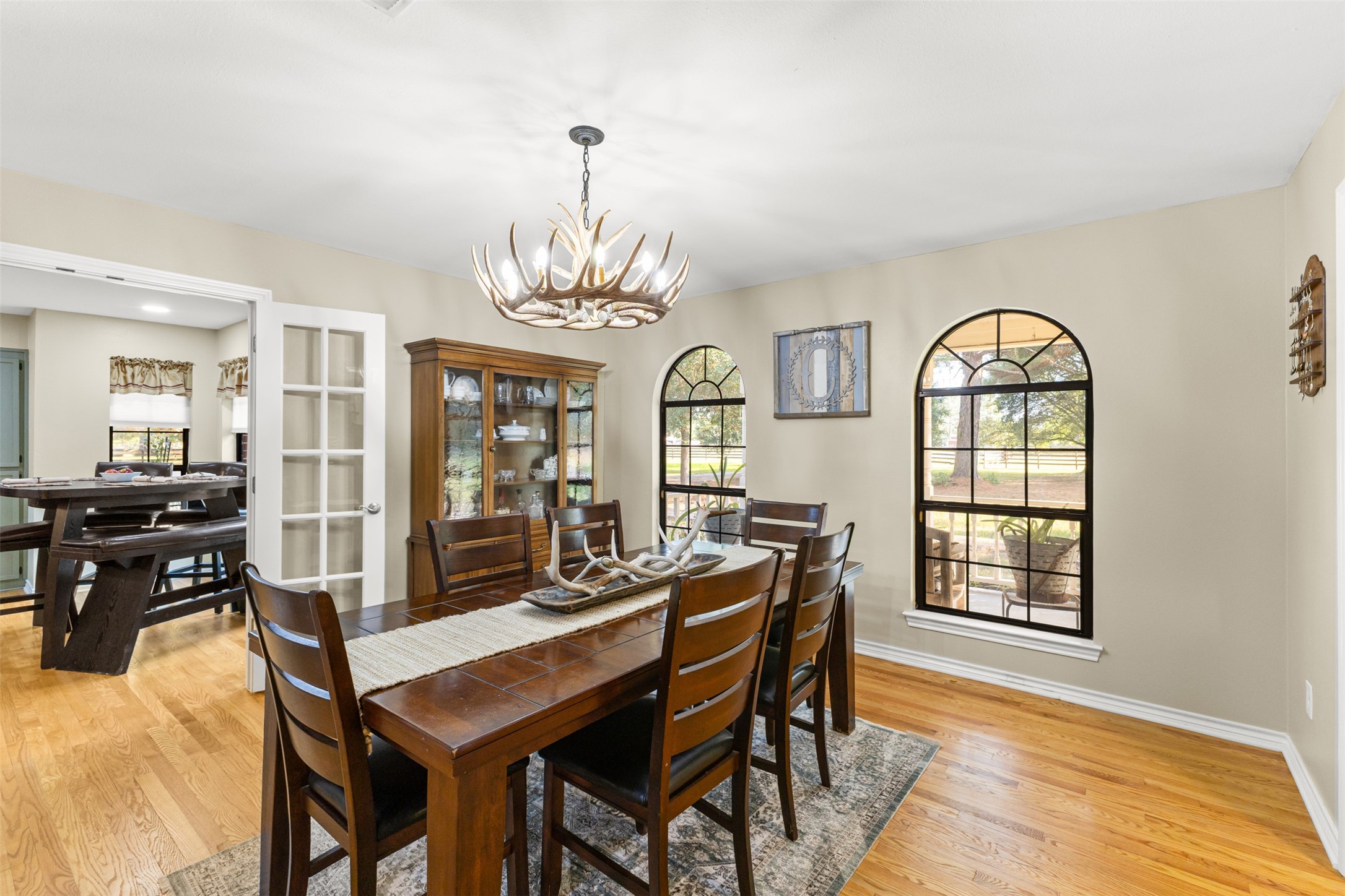 31928 Reids Prairie Road Waller, TX 77484 - Photo 10 of 49 a view of a dining room with furniture window and wooden floor