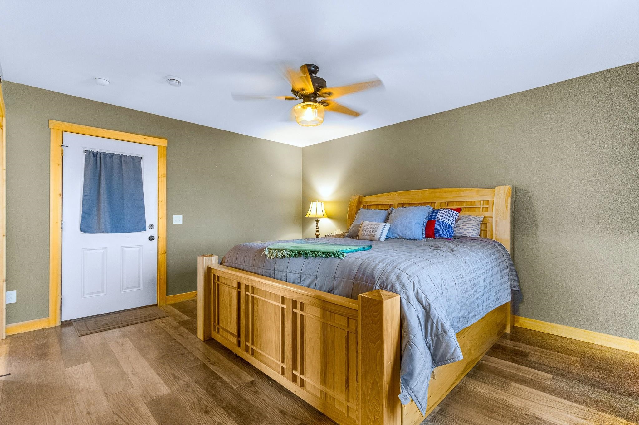 6014 Brown Road Kettle River, MN 55757 - Photo 17 of 54 Bedroom featuring wood finished floors and ceiling fan