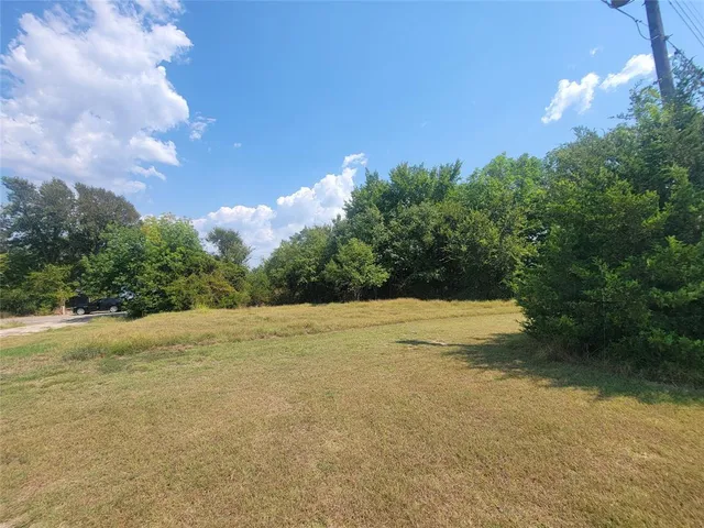 a view of an ocean and a yard