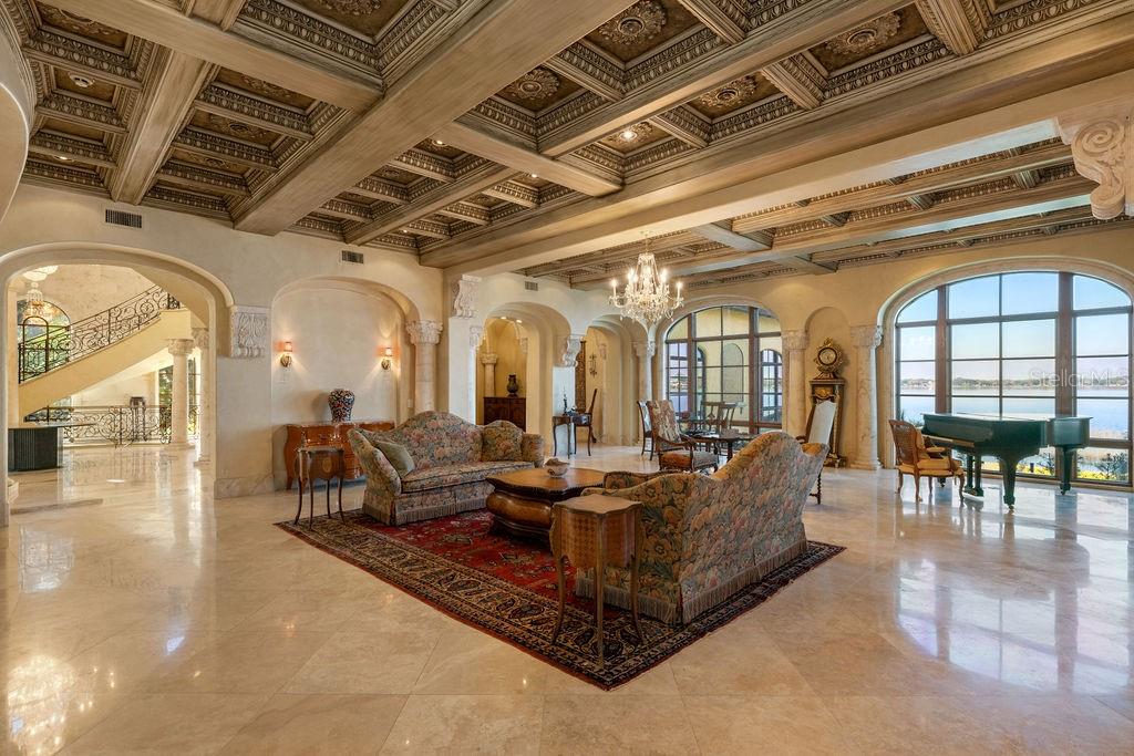 4200 Down Point Lane Windermere, FL 34786 - Photo 20 of 63 a living room with lots of furniture and a chandelier