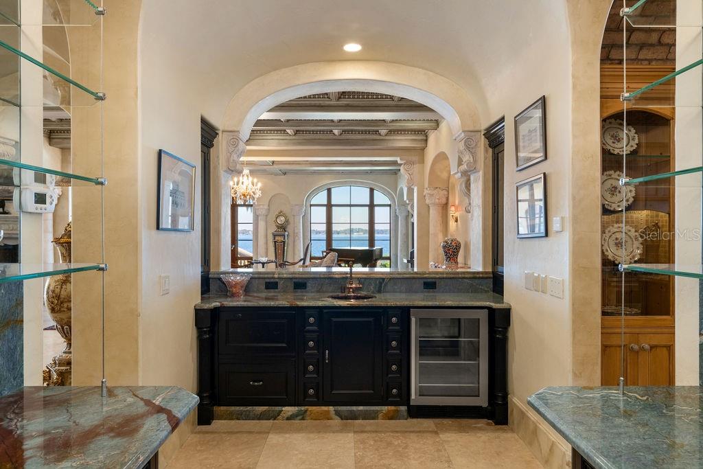 4200 Down Point Lane Windermere, FL 34786 - Photo 35 of 63 a bathroom with a granite countertop sink a large mirror and a shower