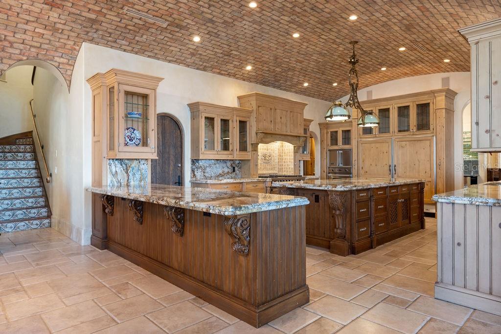 4200 Down Point Lane Windermere, FL 34786 - Photo 37 of 63 a large kitchen with granite countertop a sink and cabinets