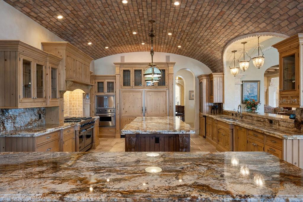 4200 Down Point Lane Windermere, FL 34786 - Photo 38 of 63 a living room with kitchen island granite countertop furniture and a kitchen view