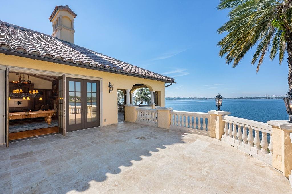 4200 Down Point Lane Windermere, FL 34786 - Photo 47 of 63 a view of a house with a porch