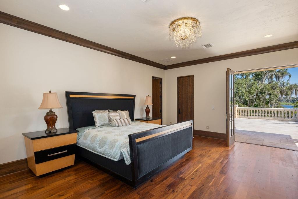 4200 Down Point Lane Windermere, FL 34786 - Photo 50 of 63 a bedroom with a bed and a window