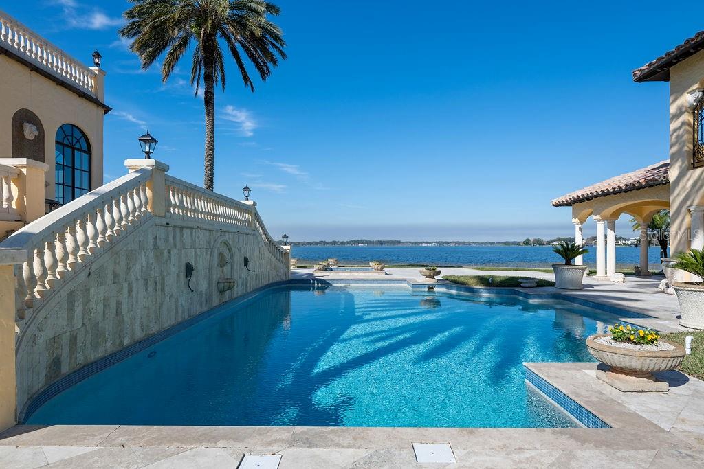 4200 Down Point Lane Windermere, FL 34786 - Photo 10 of 63 a living room with furniture and a floor to ceiling window