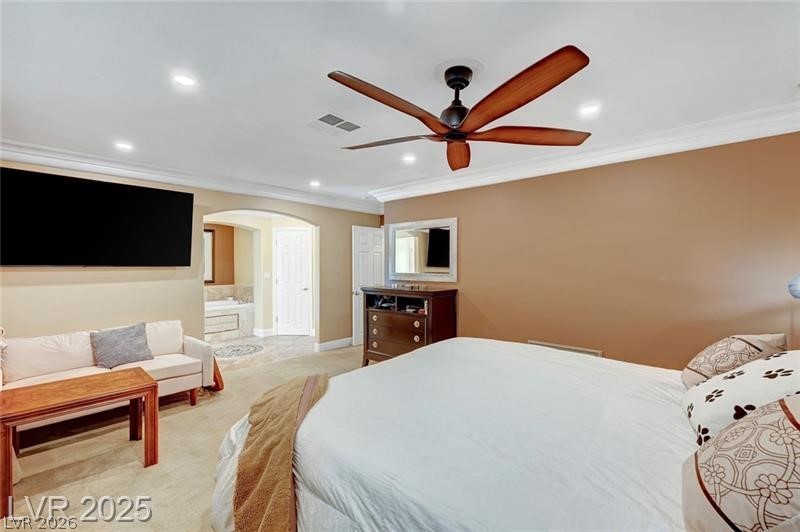 2410 Doherty Way Henderson, NV 89014 - Photo 40 of 63 Bedroom with ornamental molding, arched walkways, recessed lighting, ensuite bathroom, and light colored carpet