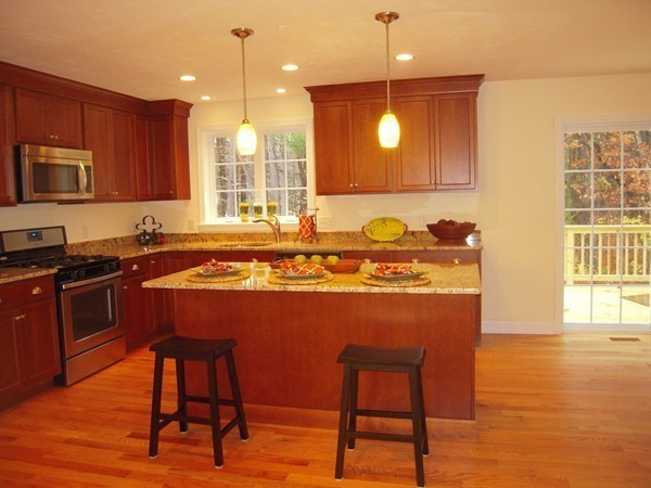 Lot 2 Liberty Square Road, Unit 1 Boxborough, MA 01719 - Photo 4 of 12 a kitchen with a sink cabinets and wooden floor