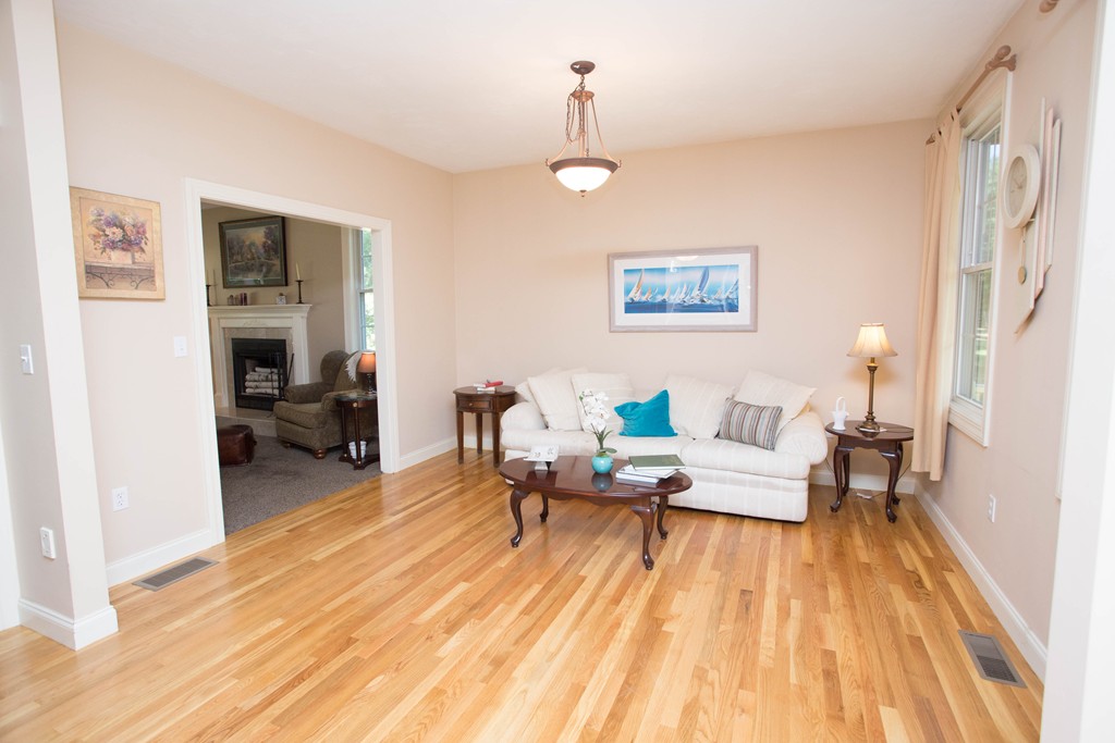 24 Zina Road Hudson, MA 01749 - Photo 11 of 25 a living room with furniture and a wooden floor