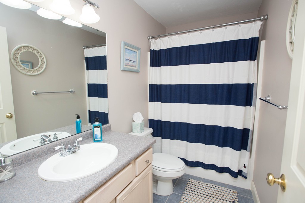 24 Zina Road Hudson, MA 01749 - Photo 15 of 25 a bathroom with a sink and a mirror