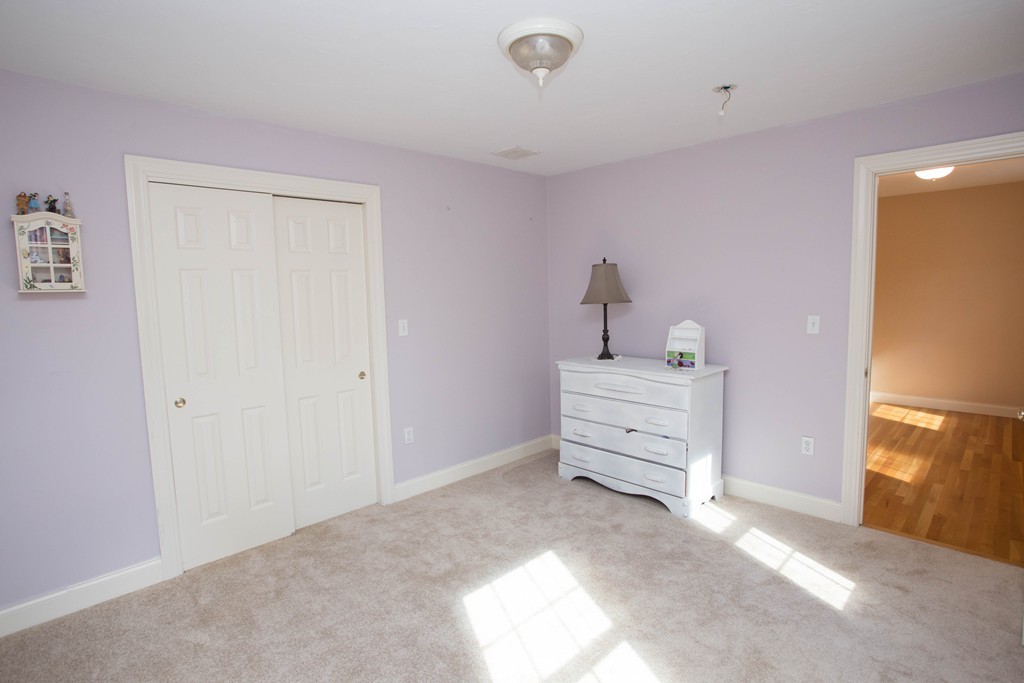 24 Zina Road Hudson, MA 01749 - Photo 17 of 25 a view of a bedroom with cabinet cabinet and windows