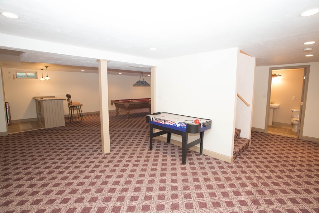 24 Zina Road Hudson, MA 01749 - Photo 22 of 25 a living room with a rug
