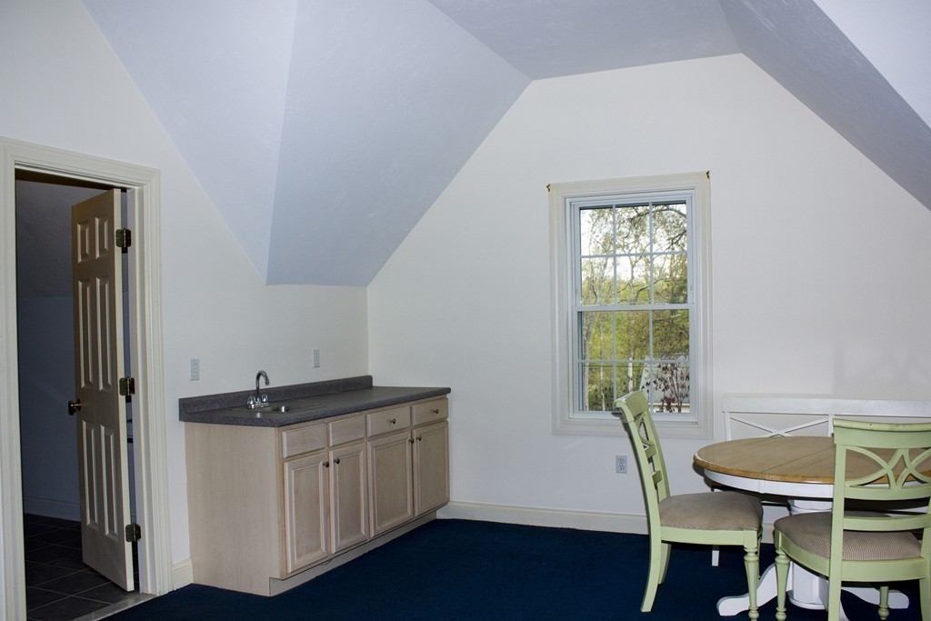 24 Zina Road Hudson, MA 01749 - Photo 24 of 25 a hallway with a table and a window