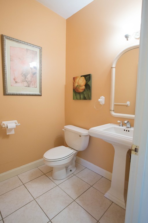 24 Zina Road Hudson, MA 01749 - Photo 4 of 25 a bathroom with a toilet sink and mirror