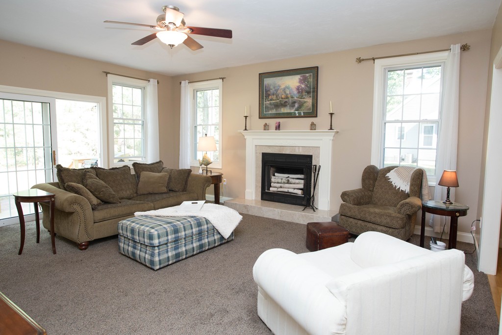 24 Zina Road Hudson, MA 01749 - Photo 6 of 25 a living room with furniture and a fireplace