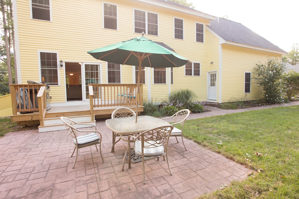 24 Zina Road Hudson, MA 01749 - Photo 8 of 25 a view of a house with backyard and sitting area