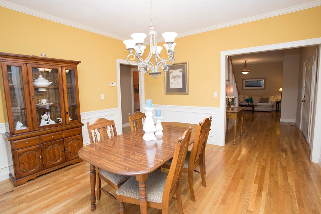 24 Zina Road Hudson, MA 01749 - Photo 9 of 25 a view of a dining room with furniture wooden floor and chandelier