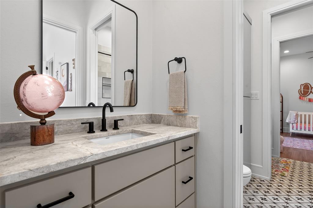 2804 Buchanan Road Hallsville, TX 75650 - Photo 27 of 40 a bathroom with a double vanity sink and a mirror