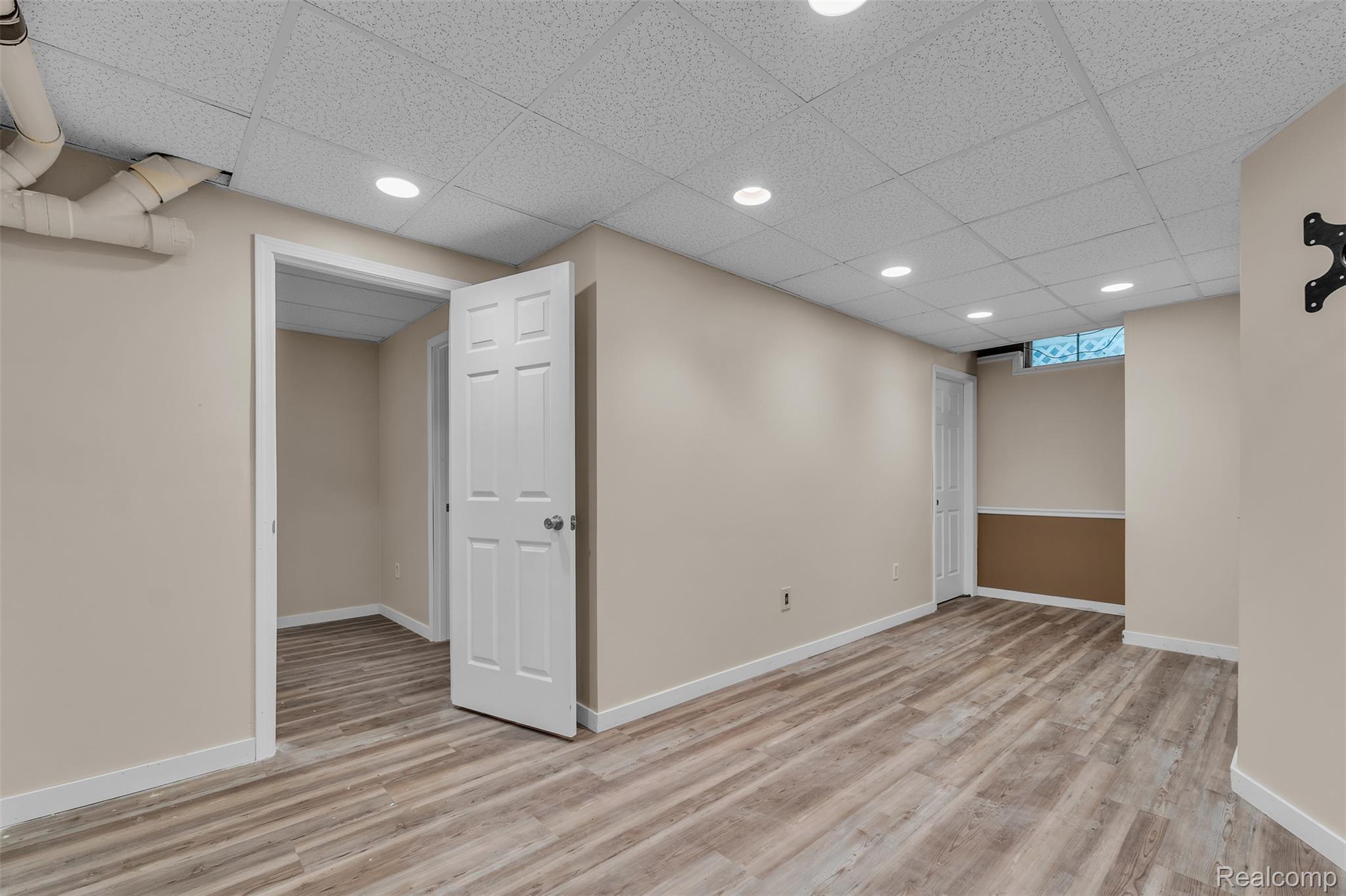 1345 Ives Road Mason, MI 48854 - Photo 41 of 92 Basement with light wood finished floors, recessed lighting, and a drop ceiling